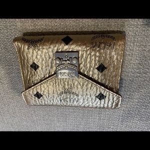 MCM trifold mini gold wallet.  Brand new without tags.